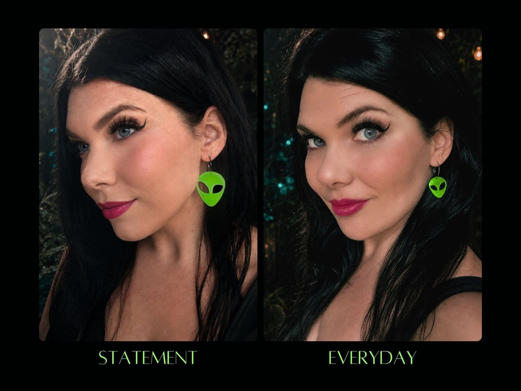 Model wearing glow in the dark alien earrings in statement and everyday sizes.