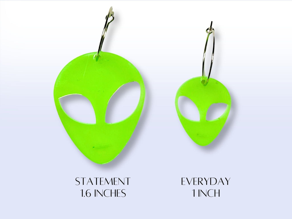 Size comparison chart for Glow in the Dark alien earrings showing statement and everyday sizes.