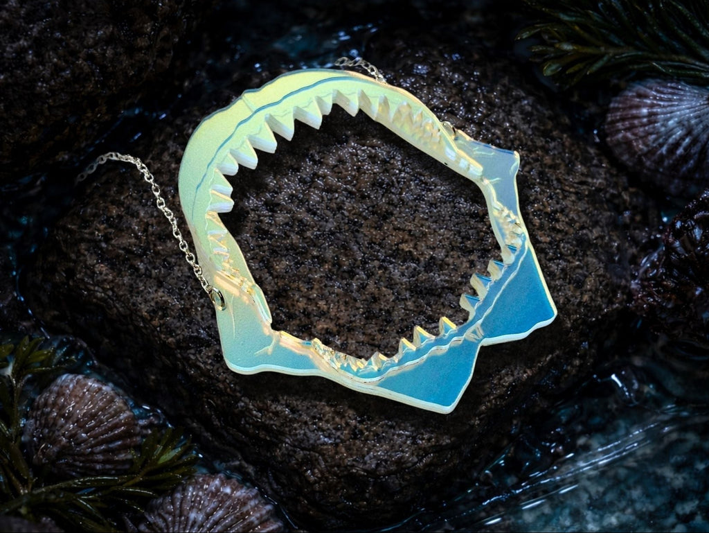 iridescent shark jaw necklace styled flatlay ocean themed statement jewelry aesthetic