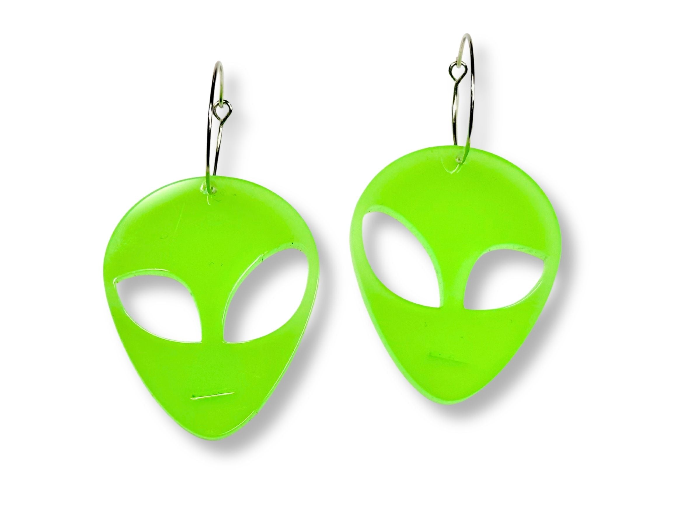 Glow in the Dark alien head earrings in neon green acrylic with silver hoop ear wires on white background.