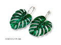 Verdant Pearl monstera leaf earrings in pearlescent green acrylic with engraved vein details.