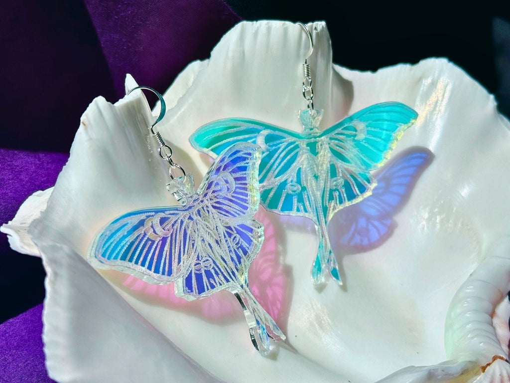 laser cut acrylic luna moth earrings showing layered wings and sculptural design detail