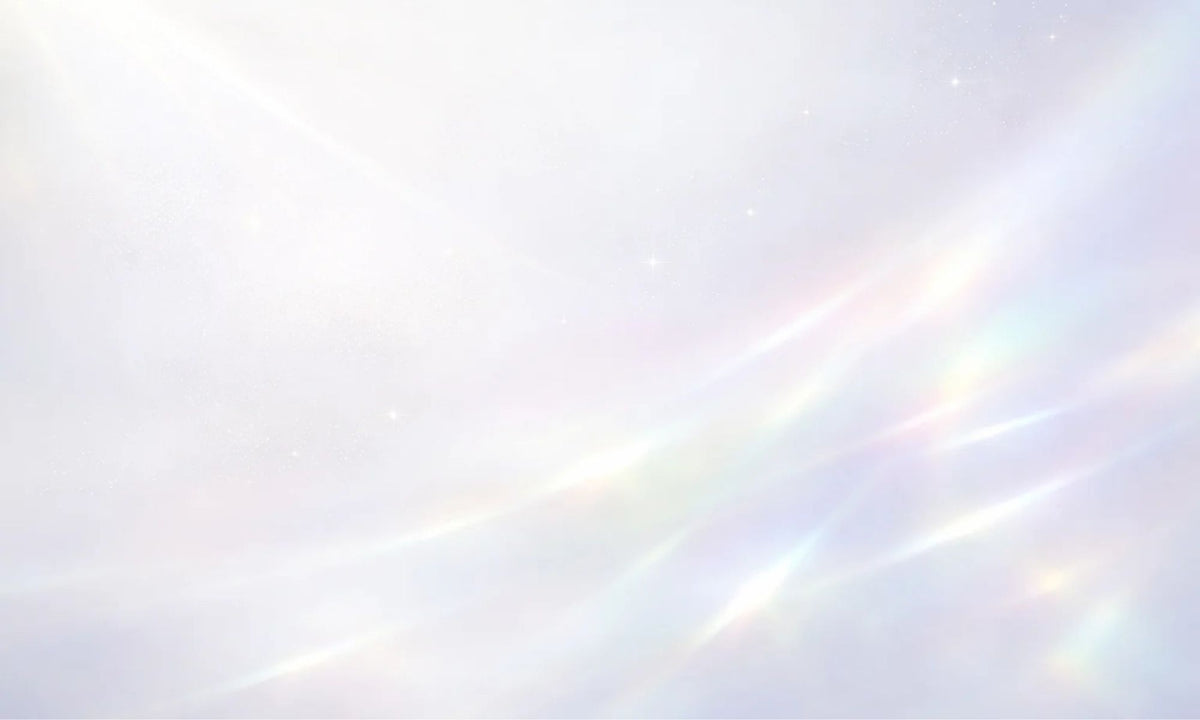 A soft, bright white and pale lavender background with delicate iridescent light streaks and faint pastel rainbow reflections.