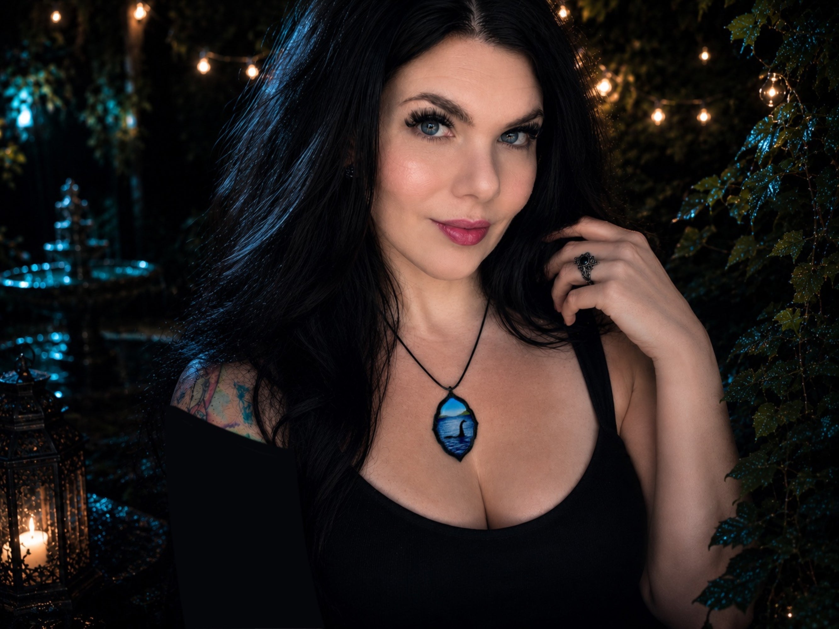 Model wearing original Loch Ness Monster pendant with gothic styling.