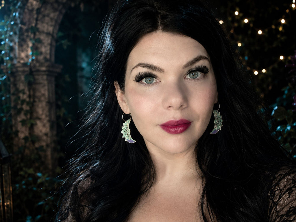 Model wearing Art Deco lotus moon earrings from the Elven Architecture Collection