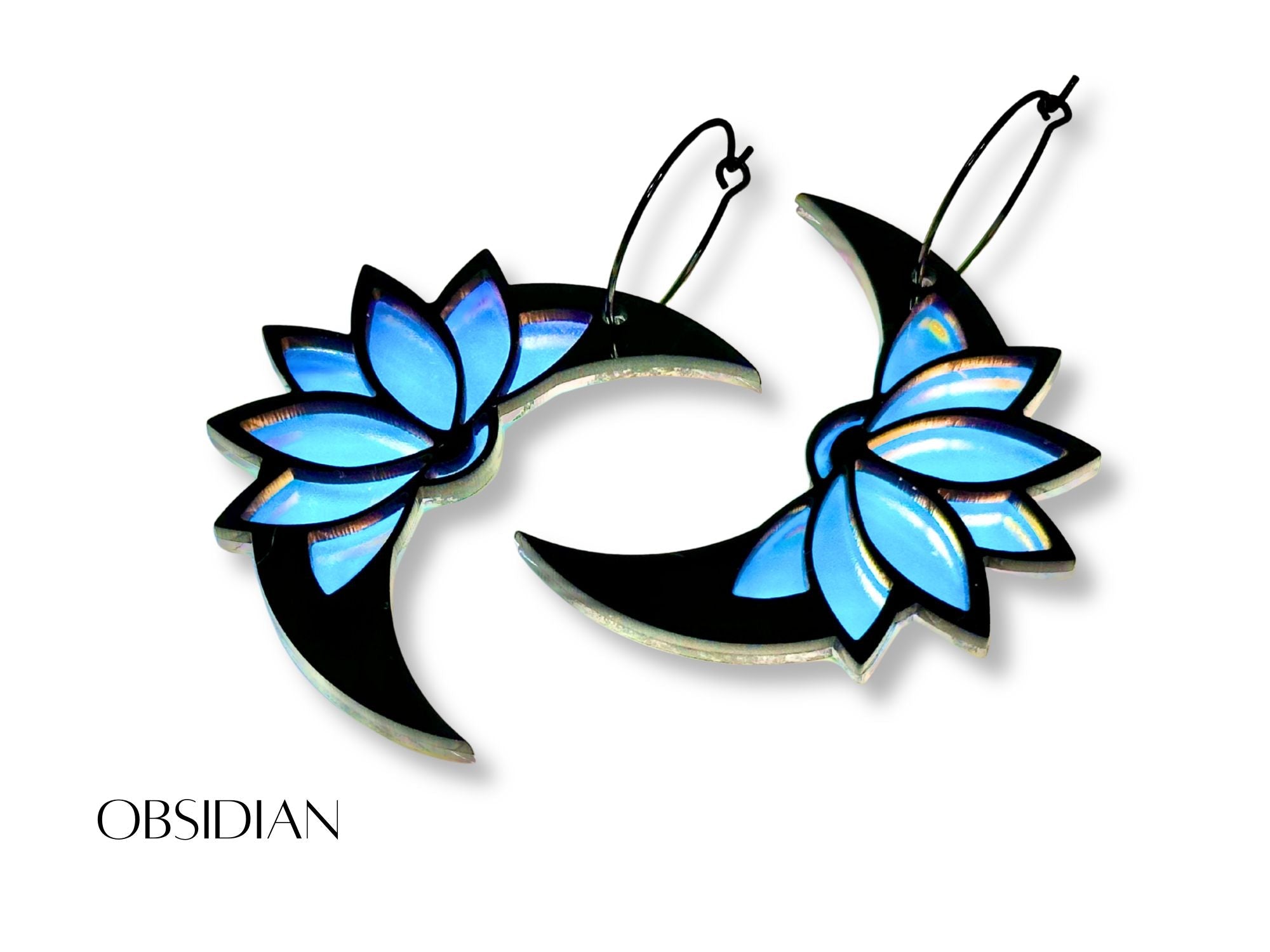 Obsidian lotus moon earrings with blue lotus petals on white background