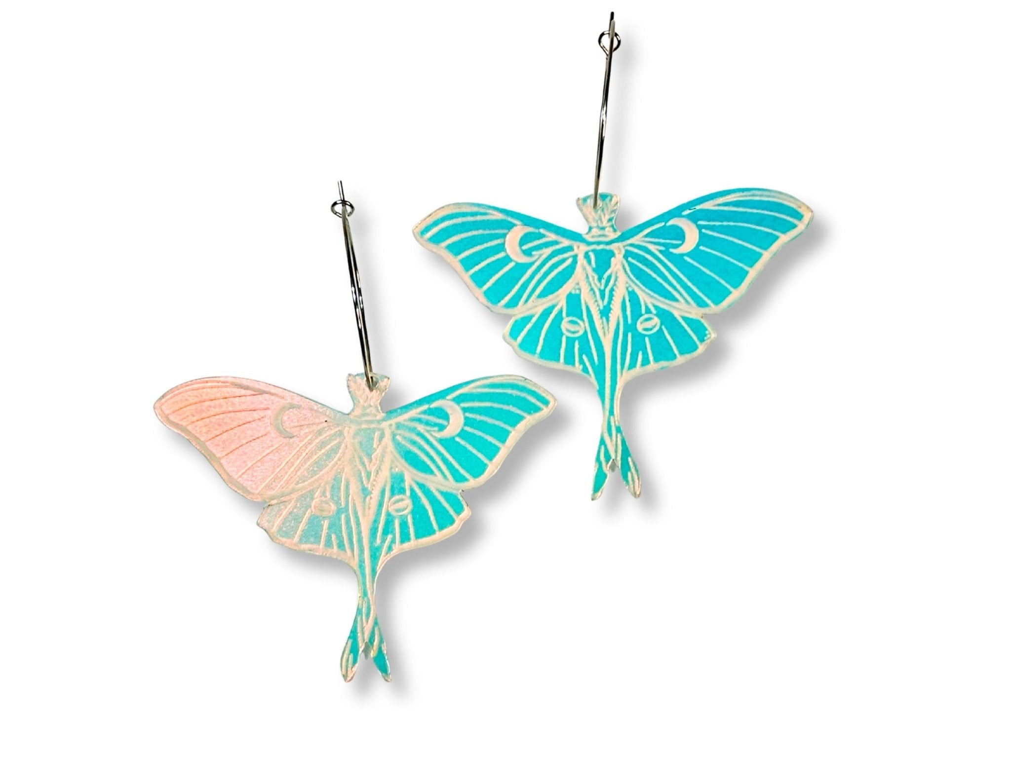 Pair of iridescent luna moth earrings with blue turquoise and pink color shift