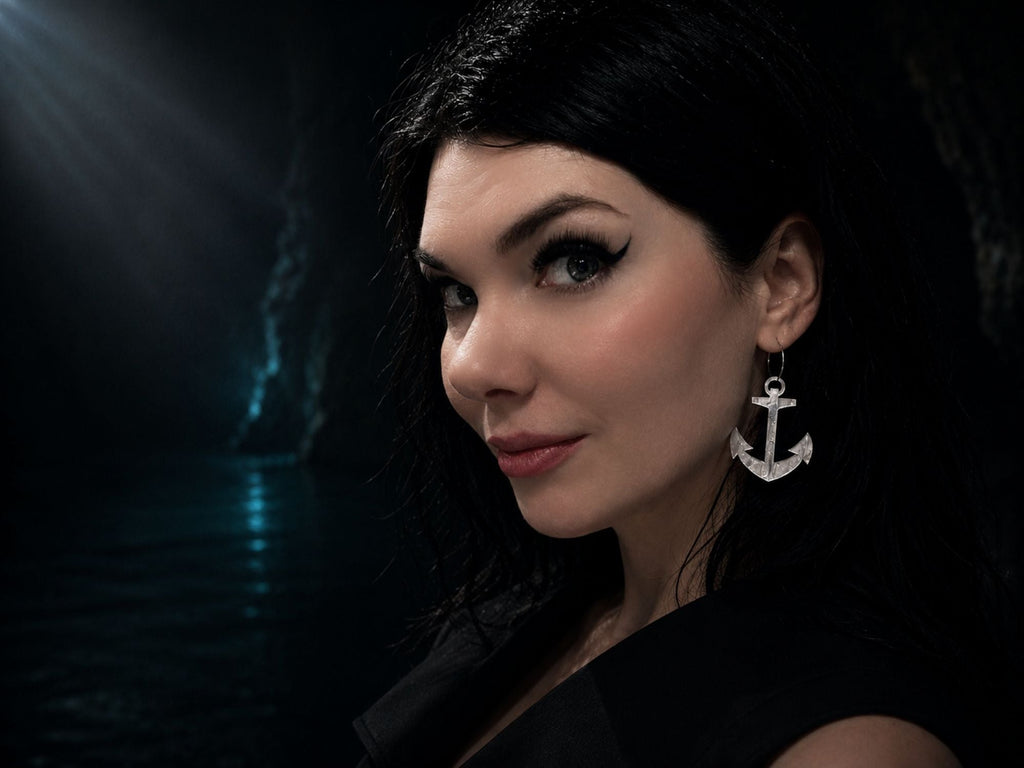 Woman modeling acrylic anchor earrings