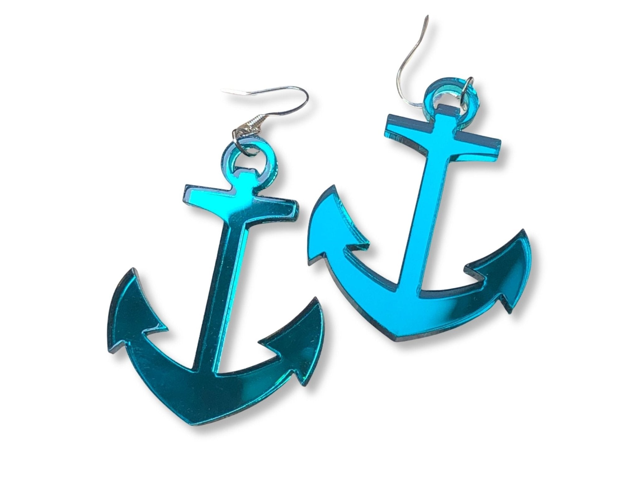 Teal mirror acrylic anchor statement earrings on white background