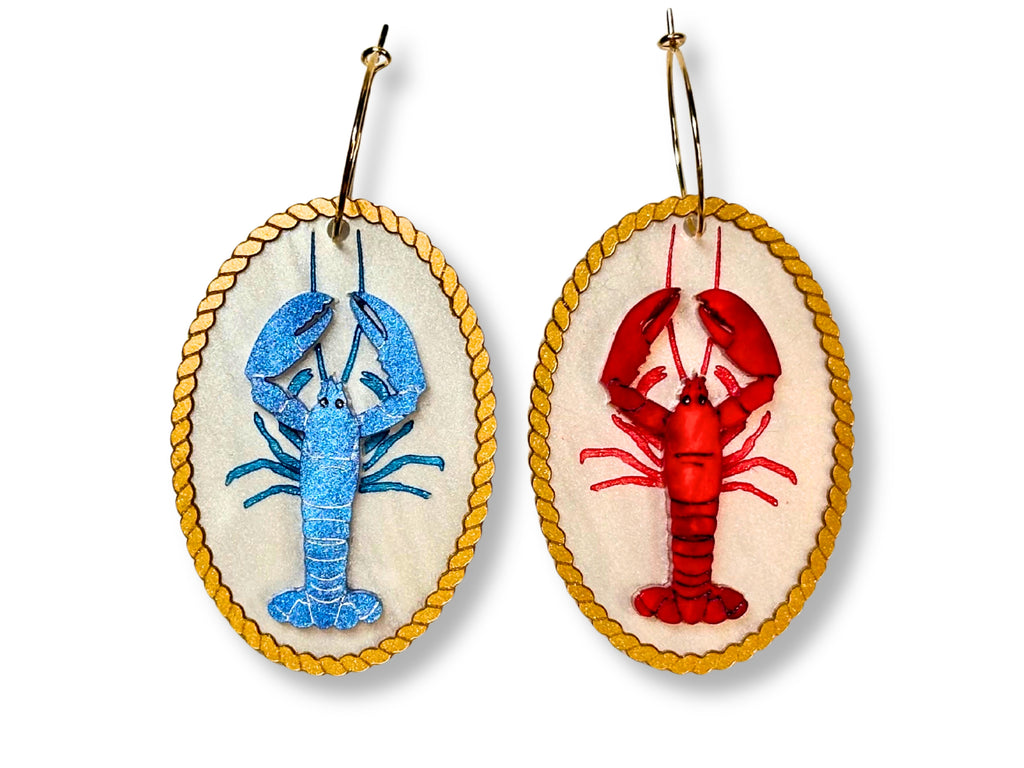 Mismatched red and blue lobster earrings with original layered artwork