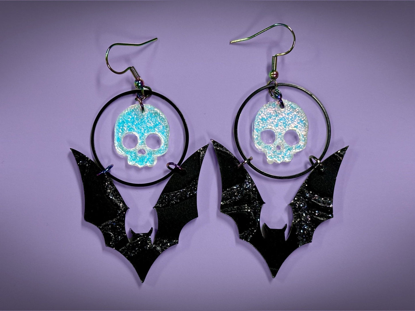 Skull and Bat Earrings | Sparkling Iridescent Halloween Novelty Dangles ! - Painted Raina