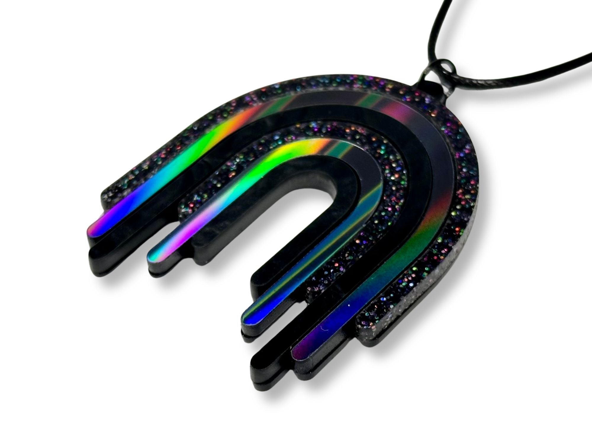 Black Rainbow Drip Pendant photographed on black cord