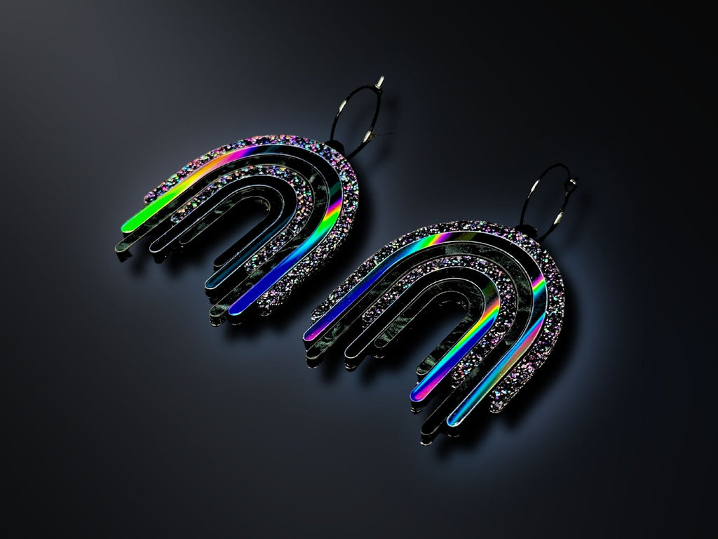 Black Rainbow Drip Earrings photographed on dark background