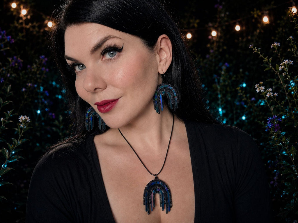 Model wearing Black Rainbow Drip Pendant and matching earrings
