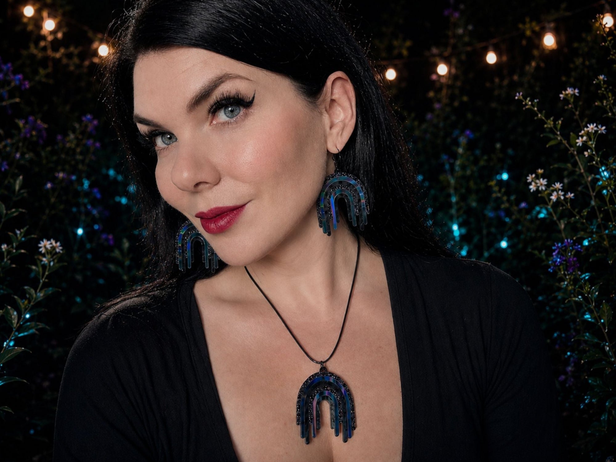 Model wearing Black Rainbow Drip Pendant and matching earrings