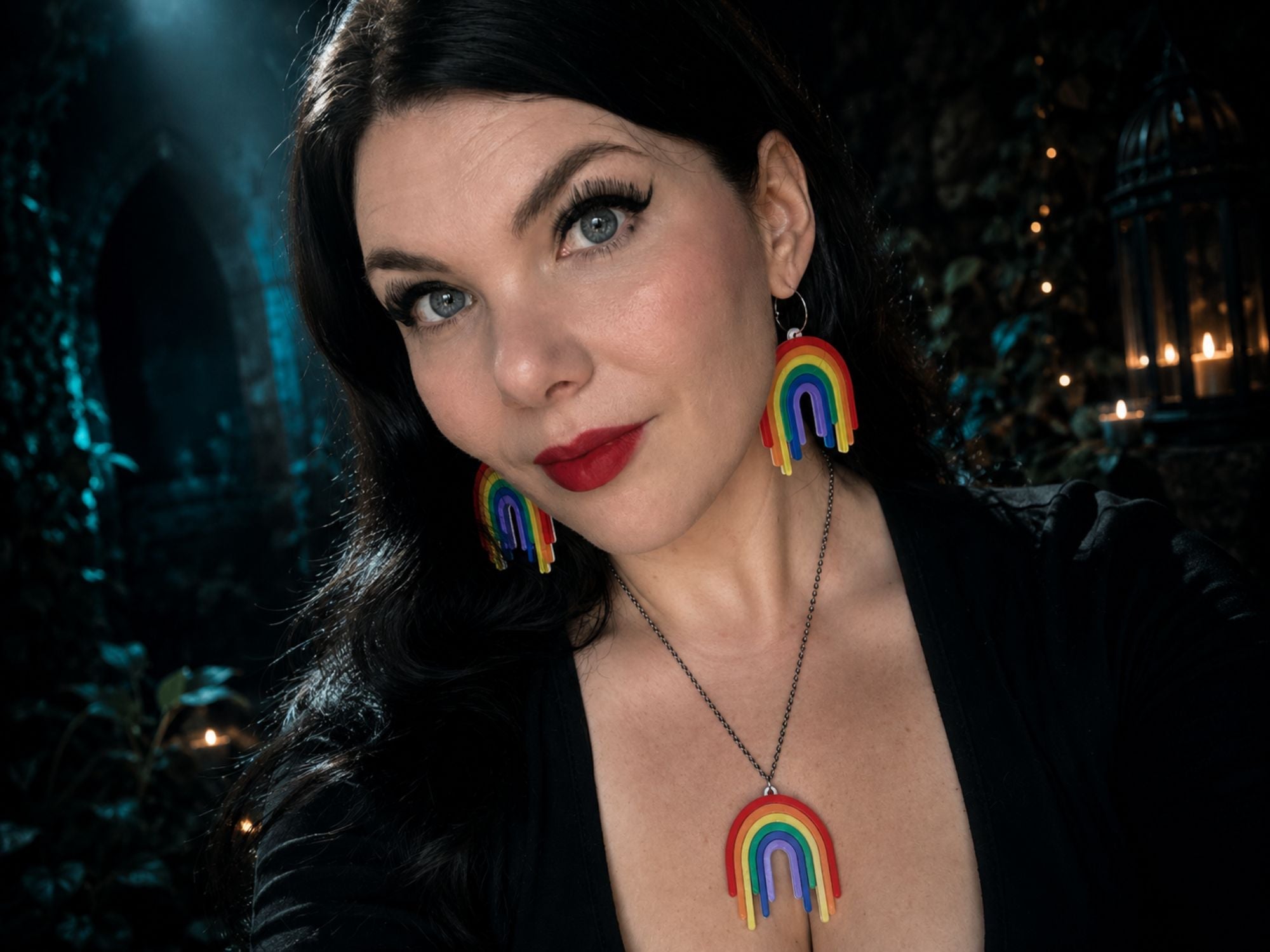 Model wearing Full Spectrum Rebel Drip Pendant and matching drip earrings