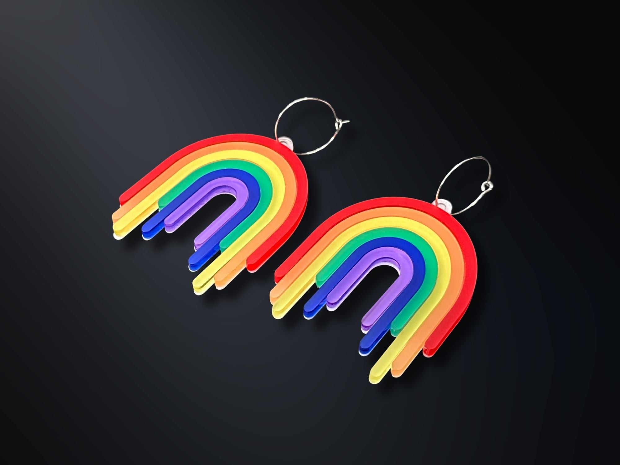 Full Spectrum Rebel Drip Earrings in layered rainbow acrylic