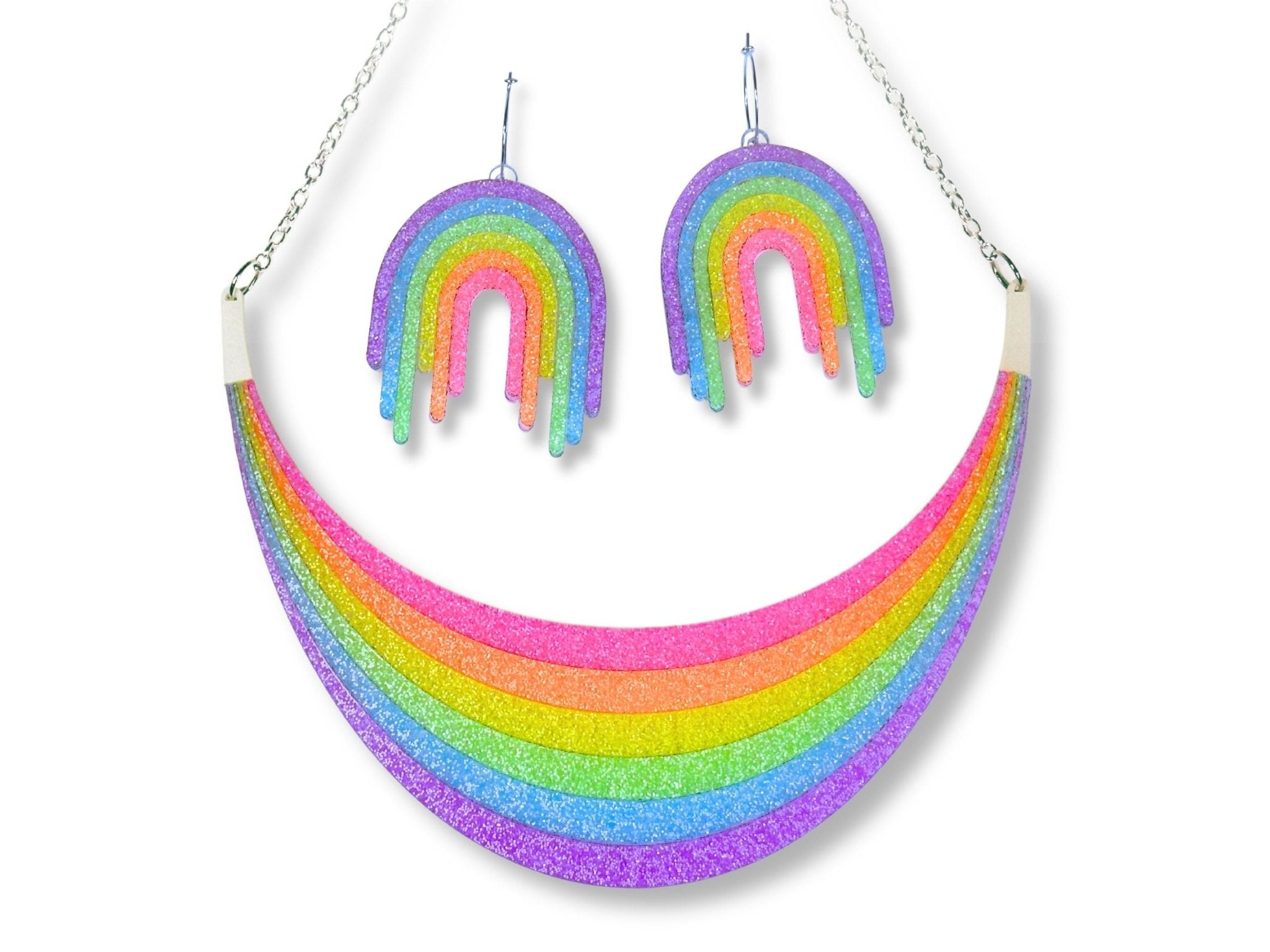Full Spectrum Rebel Set in Rainbow Rave glitter acrylic featuring statement necklace and drip earrings on white background.