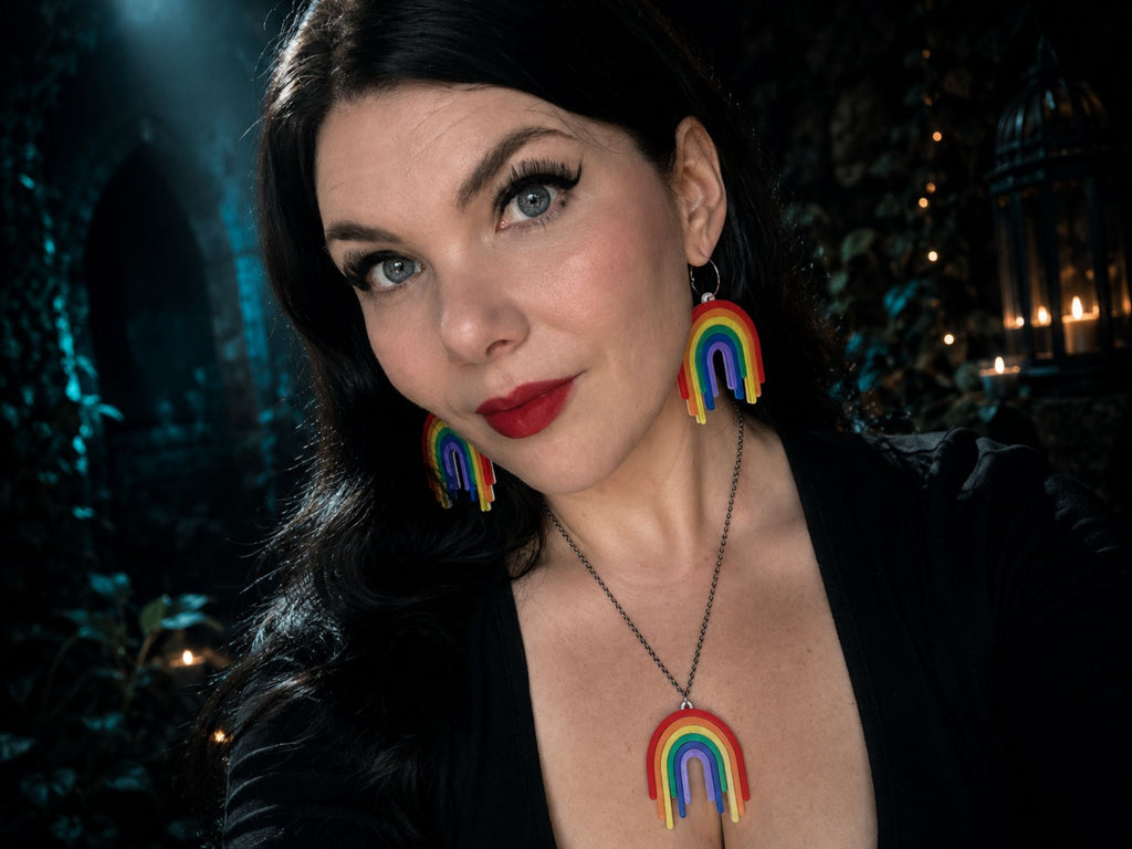 Model wearing Full Spectrum Rebel Drip Earrings and matching pendant necklace