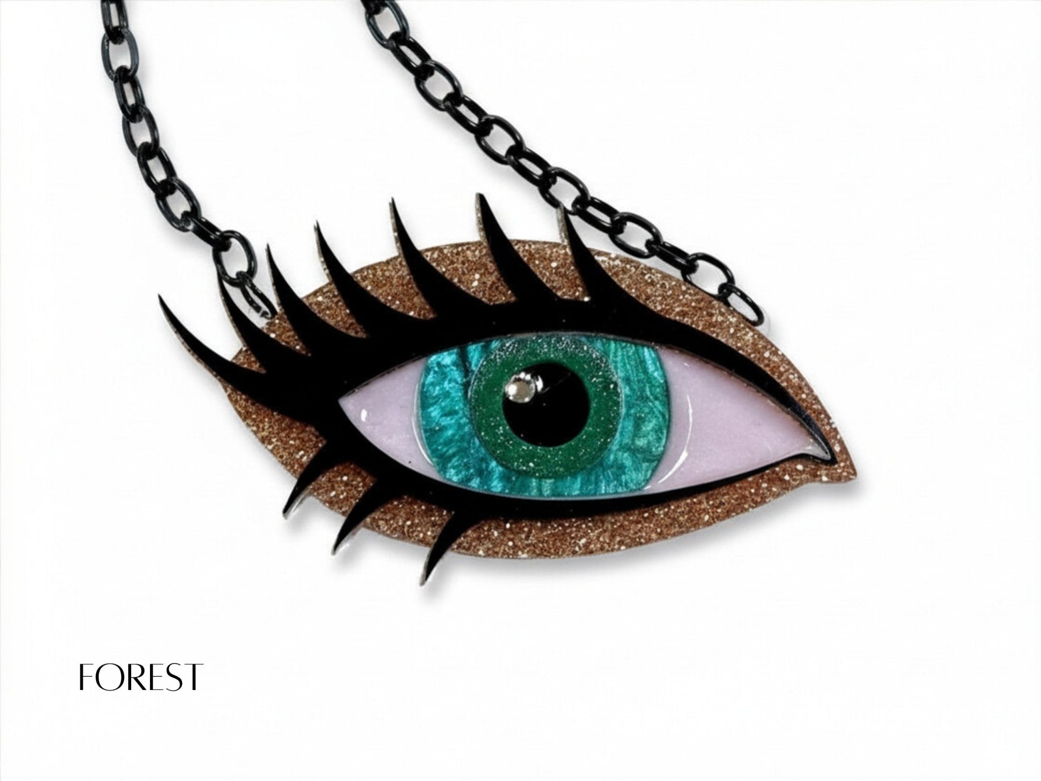 Forest Siren Eye necklace with turquoise green iris, bronze glitter acrylic, dramatic black lashes, and black chain.
