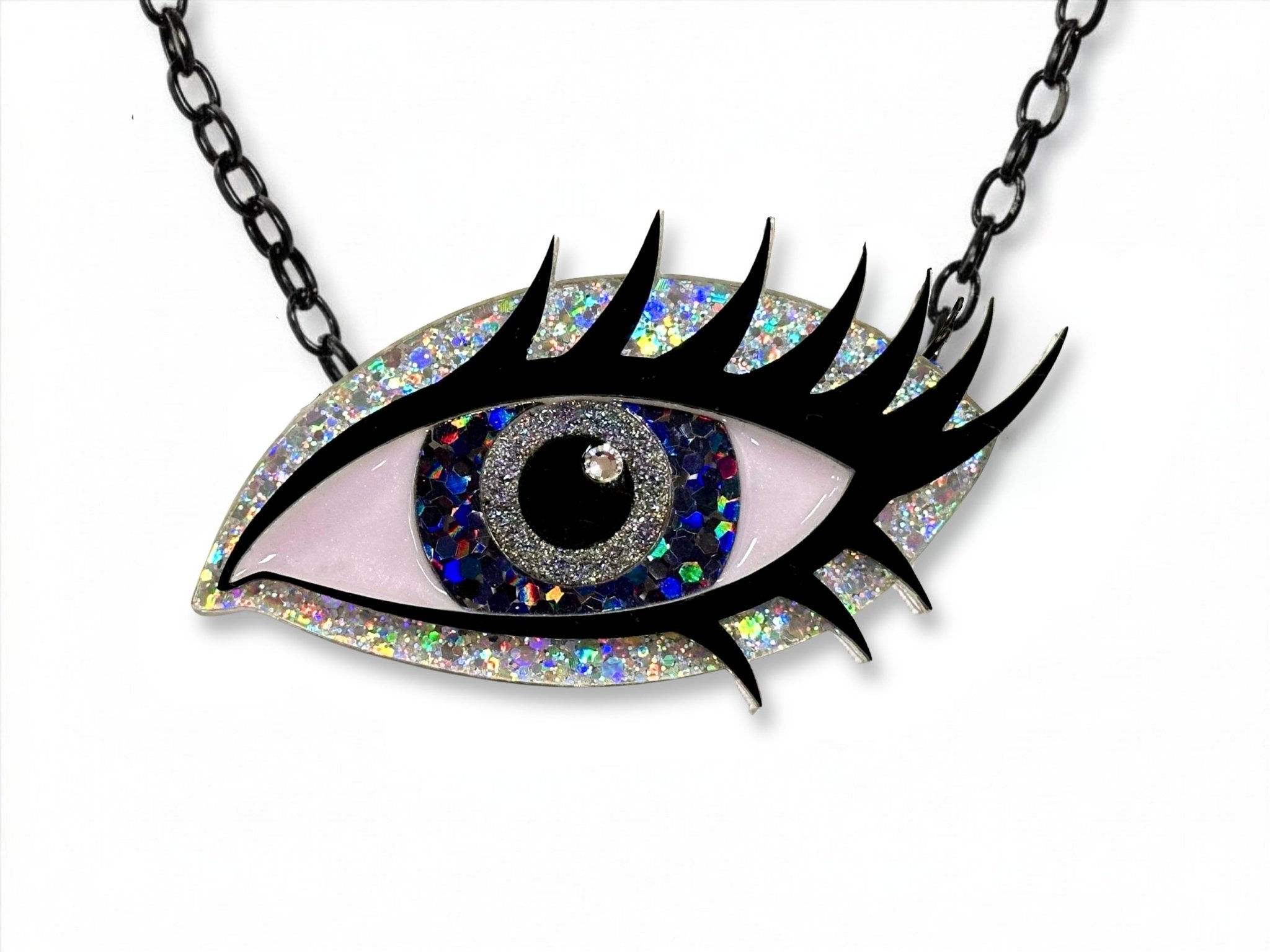 Midnight Siren Eye statement necklace with silver holographic glitter, dark multicolor iris, black lashes, and black chain.