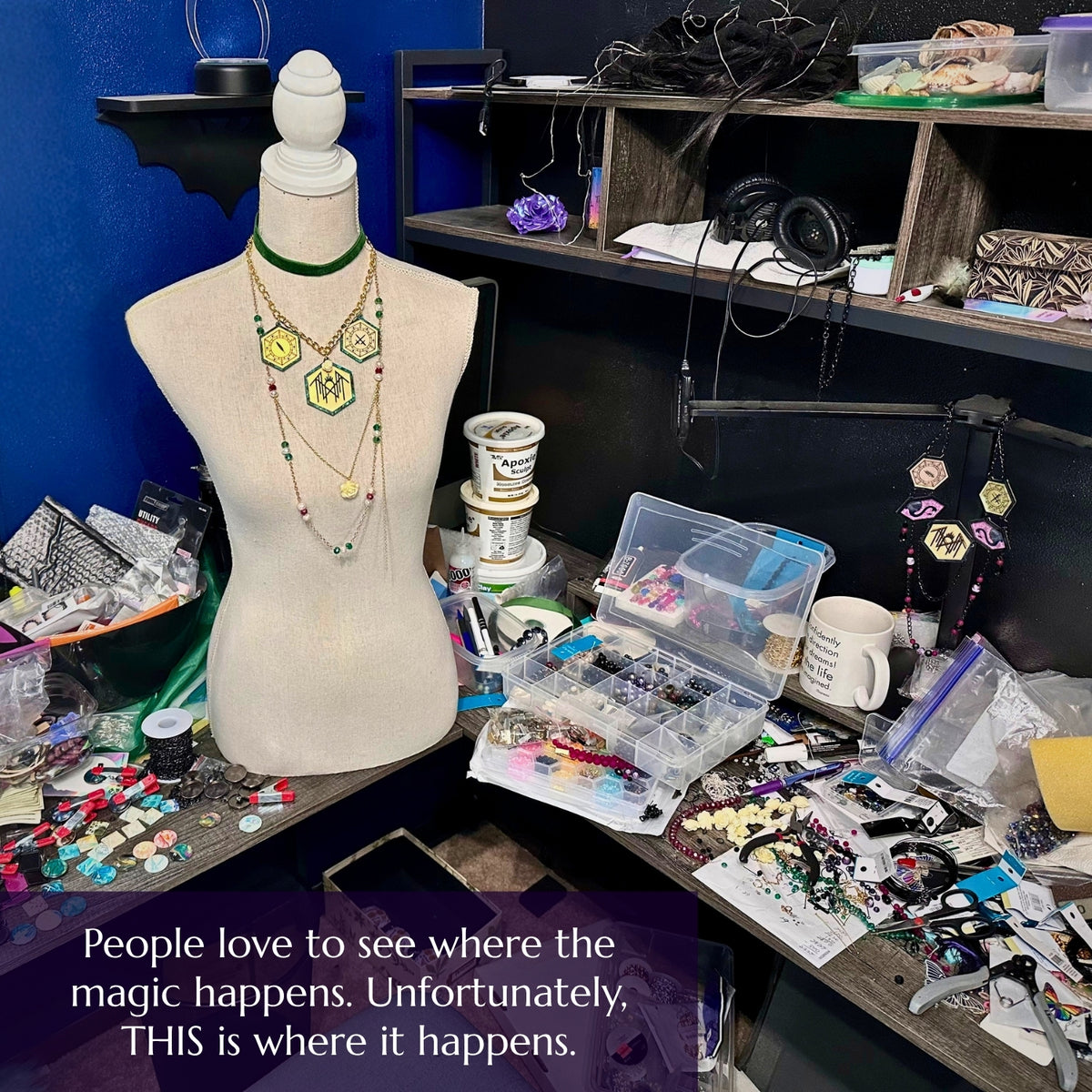 Raina’s crowded jewelry assembly desk covered with tools, acrylic components, beads, findings, works in progress, and finished necklaces.